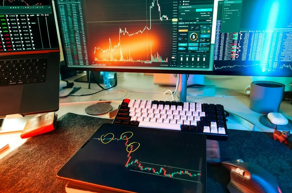 Bureau de trader avec écrans de graphiques financiers, illustration du staking crypto chez Interactive Brokers